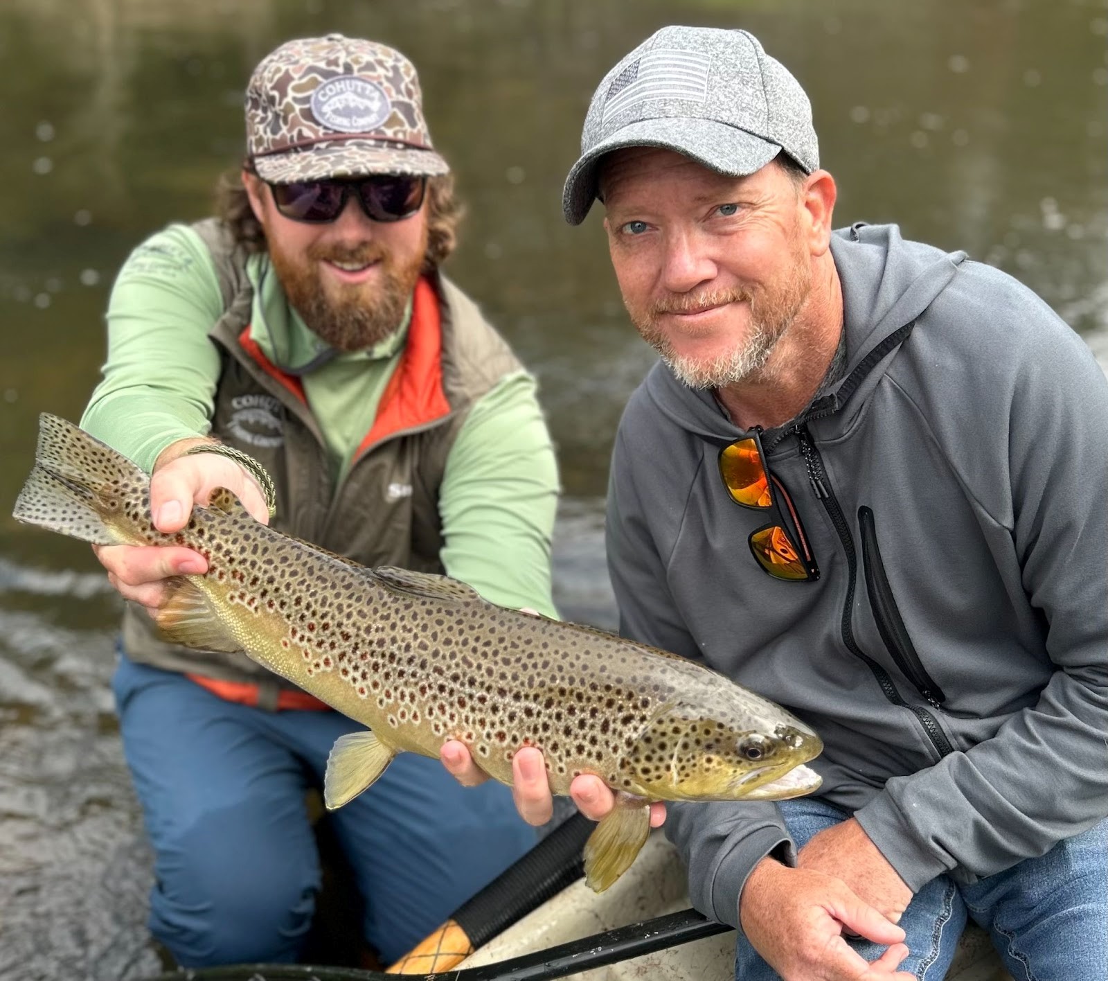 Guide Matt Morrison and client Stephen with a 22” brown trout caught out of some shallow water